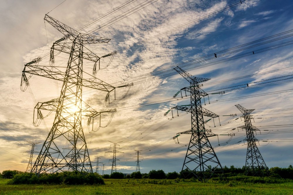 Transmission towers and power lines under the morning sky in Ontario