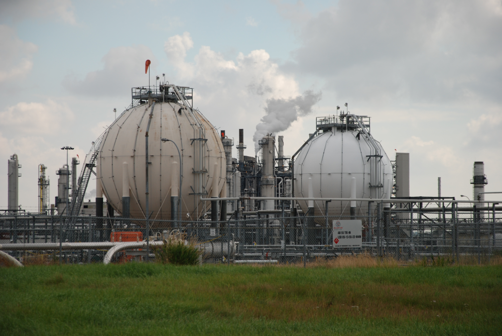 Cylindrical storage tanks at an oil and gas facility