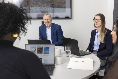 Business people conversing around a table