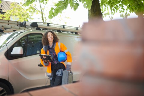 female electrician arrives at job site