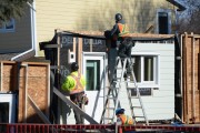 Two men working on a building construction site. 