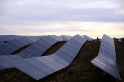 Solar panels on a field at dusk in Innisfail, AB.