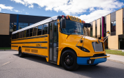 Electric school bus at a school